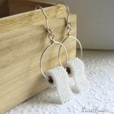 And to keep the Dumpy Duck company, here are some toilet paper earrings by LiciaBeads
