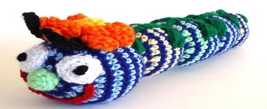 At a loss for what to give that special infant in your life? How about a scary knitted caterpillar with crazy eyes? By AllKindsOfArt