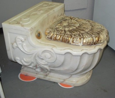 Gold-plated Italian marble toilet. The price tag of $7,499 is a drastic reduction because the gold is a little worn. CreativeCraftyGifts