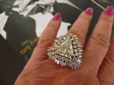 What a terrible waste of perfectly good diamonds. $27K gets this big, bad bauble on your finger, but youll need to spend another bundle on some kind of hydraulics so you can raise the arm its on. By VeryFrenchByDesign