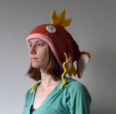 What makes this adult-sized fish hat (not words that should go together, by the way) hilarious to me is not just how dopey it is. It's also the complete joylessness of the woman wearing it, who, I suspect is either the maker or owes the maker money. By AdLibitumCrochet