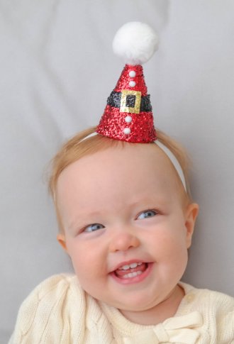 Okay, she's very cute, but you know that hat's going into her mouth in about two seconds, and that glitter does NOT look edible. By PrideAndPrincess