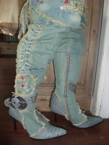 These horrifying creations are called "Gorgeous Designer Lace Up Corset Style Crystal Embelished Knee-High Fuax Snake Skin/Fur Washed Denim High Heel Boots" That does pretty well sum it up, minus the first two words. By the deluded ParrotAndPunchbowl