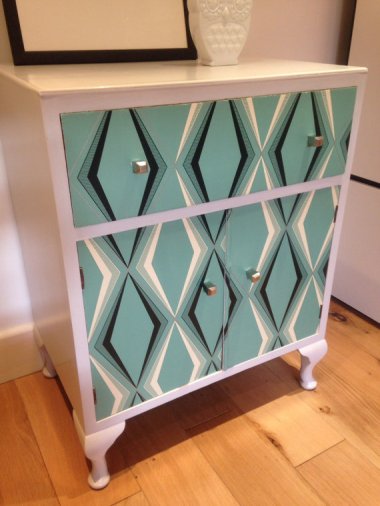 Now THIS is a creative use of decoupage! Absolutely stunning cabinet by TrashyTrend