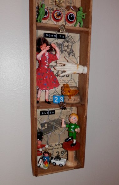 "Mixed media assemblage" is about all you can say about this piece of art which is, per the description, "Sure to get some looks!" By SlipSlopSlap who needs to have his hot glue gun taken away