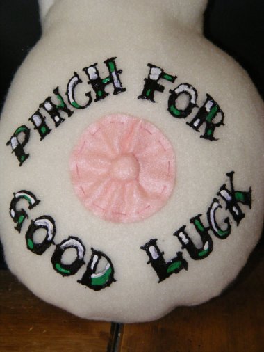 I know that boob scarves are sometimes worn in support of a loved one with breast cancer. However, I feel that "Pinch for Good Luck" by BoobsRUs may have missed the point