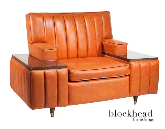 I want to make fun. Really I do. It's burnt orange naugahyde, for heaven's sake. But it's got such flair I can't do it. I couldn't live with it, but I admire it's chutspah. Sold by BlockHeadFurnishings