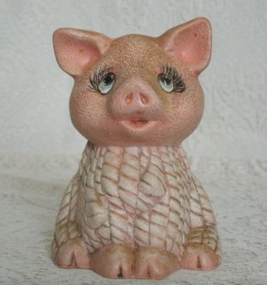 The figurine is bad, but the item name is worse: "Vintage Pig Figurine, victorian steampunk cottage chic home decor gypsy retro collectable country western farm rustic kitchen animal ranch." Sold by SheekyDoodle
