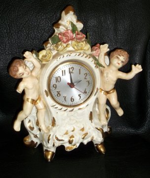Those cherubs are looking suspiciously booby. Vintage porcelain eyesore sold by LoveAndLegacies