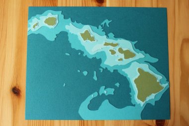 This relief map of the Hawaiian islands is actually a lovely souvenir. Except that it ships from Minneapolis. By Crafterall, who offers a few other locations as well