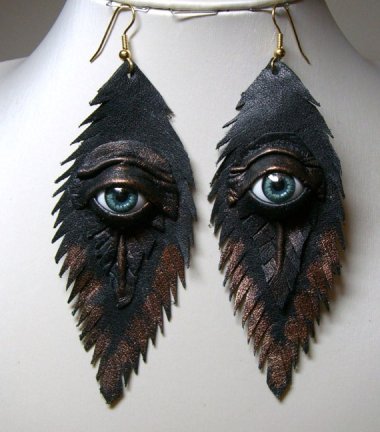 I don't know whether I'm more bothered by the fact that these earrings have eyes or the way they are mismatched. From LeasBoutique