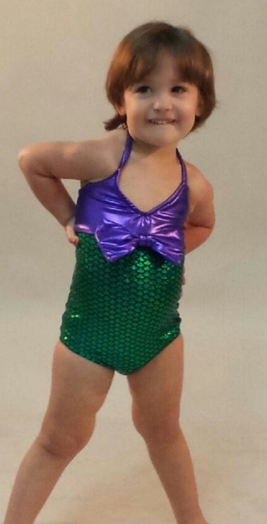 Let's start with something sweet for a change. How cute is this little girl in her mermaid suit? By TAILZmermaidGear (who also make great mermaid tails which I have purchased before)