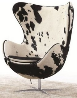 As much as I love the iconic black and white hide chaise, I think the shape of this chair is actually a bit more eye-catching. Sold by Houzz