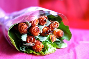 I don't know how to feel about these bacon roses. On the one hand, tacky. On the other, bacon! By DitzyBlondes
