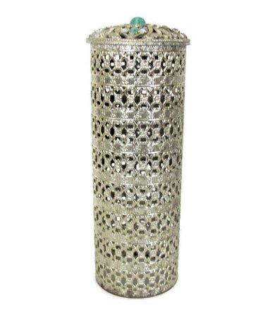 And we didn't invent the idea of bedazzling items that needed no decoration either. Here's a mid-century sparkly hairspray cover. Sold by ThirstyOwlVintage