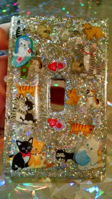 Anybody could have a glittered light switch cover, but this cat-and-glitter-covered item is one of a kind! (We hope.) By CrimsonAngelLooks