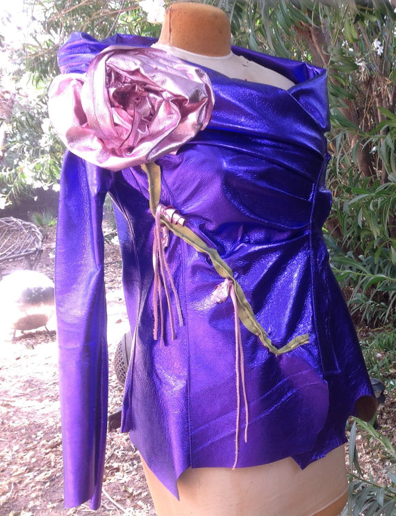 Ruched metallic leather. . . something. It wouldn't be so bad if it weren't for the giant flower. And the fact that it needs to be plugged in at night. By ShowDiva