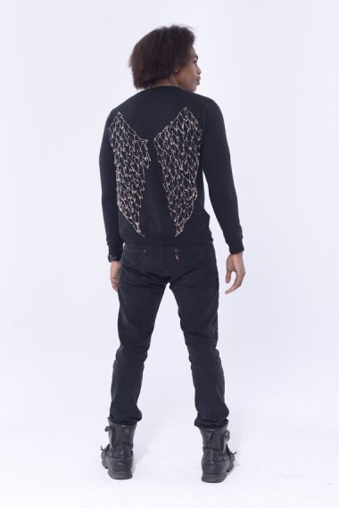 In case you've ever wondered what $49K would buy you on Etsy, here's your answer. It's a plain black sweatshirt with safety pin 