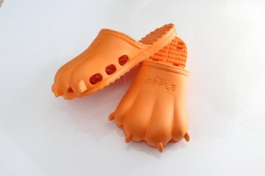 Know what would go great with that potholder shawl? How about some gimmicky knock-off Crocs? By Asiatiqueshop