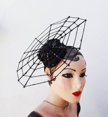 This is pretty cute as spider web hats go, but I can't help feeling like Barbie dries her clothes on that thing. By BatcakesCouture
