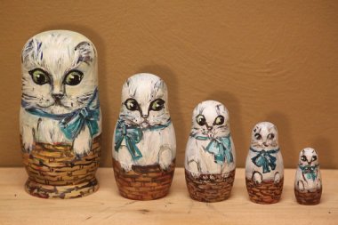 Nervous-looking cat nesting dolls. Considering where they're headed, I guess it makes sense that the biggest one looks the most anxious. By SersonArt