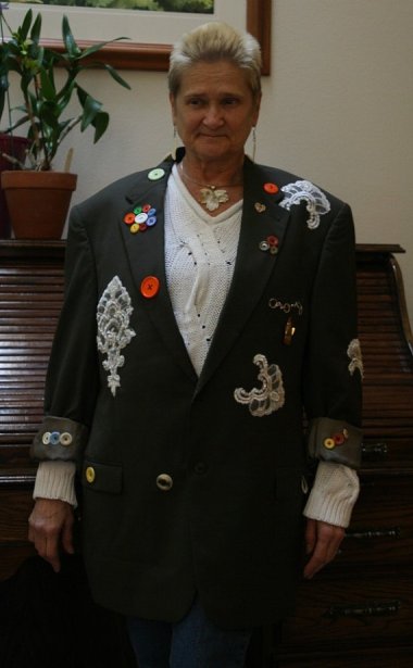 I assume she cleaned out the bottom of her purse, then glued the junk that accumulated in the bottom to a jacket. At least one of those