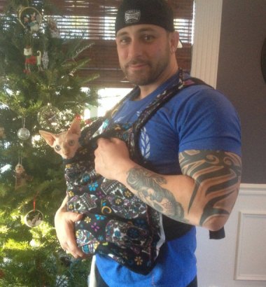 I was all ready to make fun of this "Real men love cats" sling, then I read it's to help abused animals feel safe and realized I am an asshole. By SimplySphynx