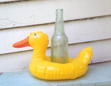 That poor fucked duck doesn't look like it could hold up anything, much less a bottle.