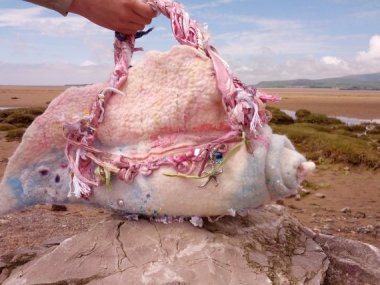 If you were worrying about what to carry on the beach, why not consider this felted bag depicting some kind of alien genitalia?