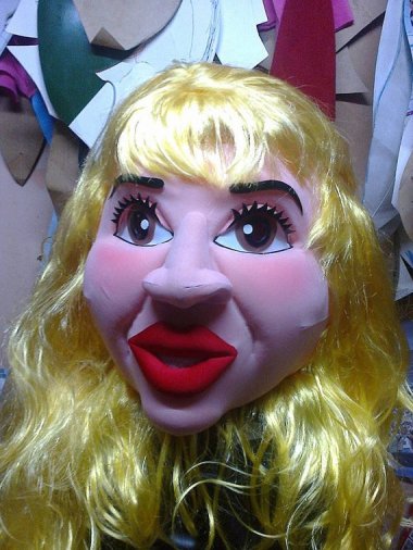 This is an exotic dancer mascot costume (already WTF) but the listing is for "HEAD ONLY STD." What on earth is a head-only STD?!?