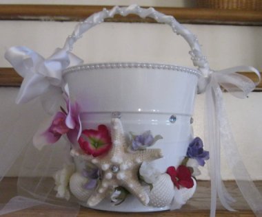 Exotic flower girl pail, presumably for her to vomit into.