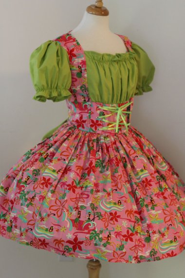 Though it is described as a hula dress, I think they're getting their dances confused...